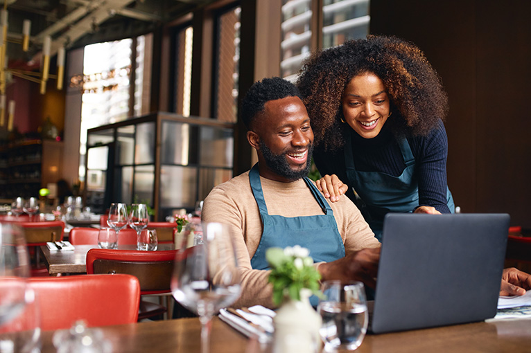 Couple working on website design together